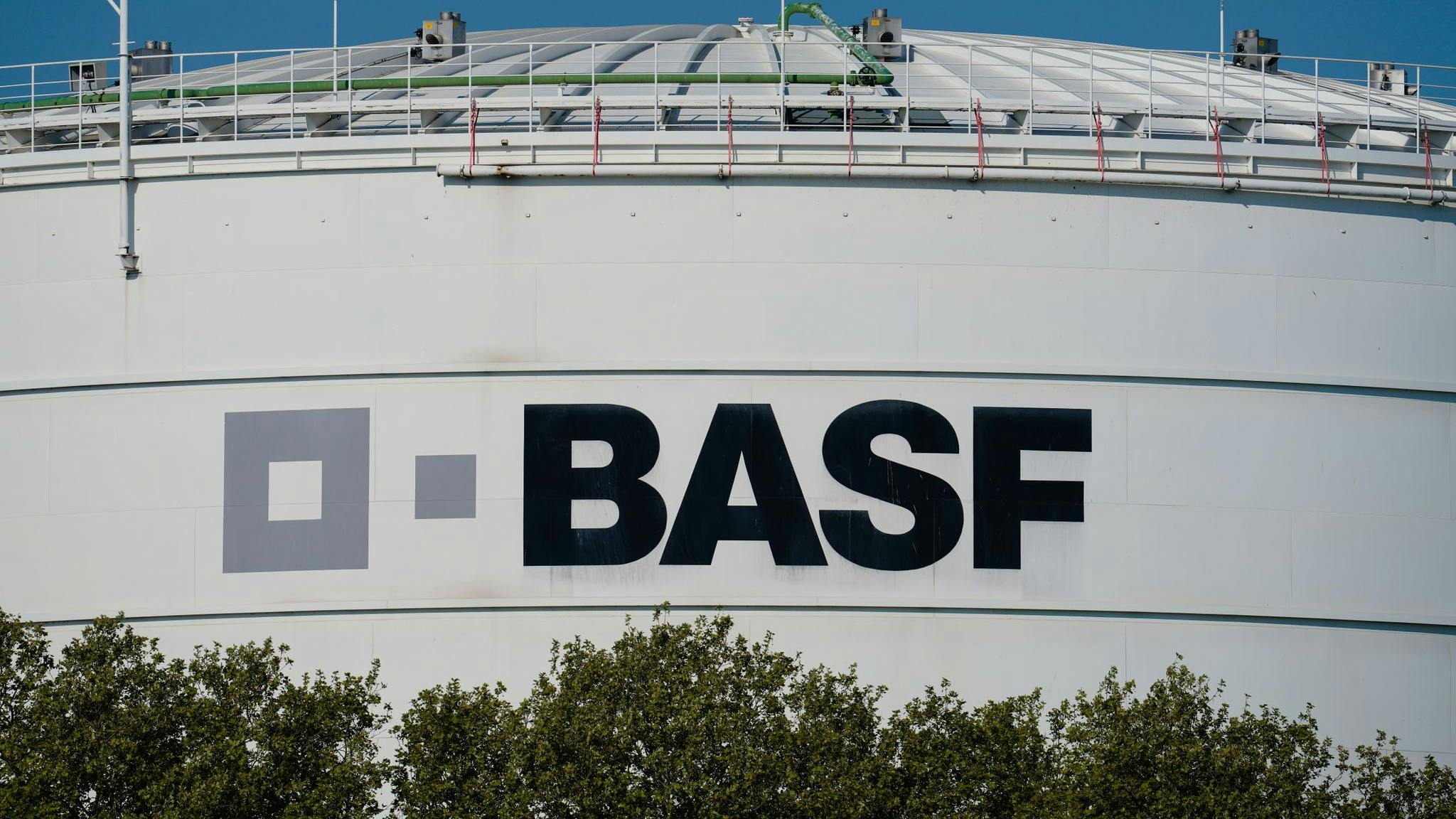 A logo of the chemical company BASF is seen on a large storage container at the main plant.