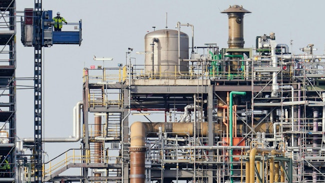 A worker rides in an elevator beside buildings on the premises of the chemical company BASF. Business sentiment in Germany's chemicals industry fell to its lowest level in more than two years in October, the ifo Institute said on Monday, as weak orders and foreign competition continued to weigh on the sector. (Uwe Anspach/dpa/TNS)