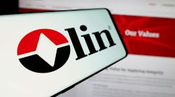 Cellphone with logo of American chemicals company Olin Corporation on screen in front of business website. Cellphone with logo of American chemicals company Olin Corporation on screen in front of business website.