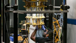 Engineer operating advanced quantum computing equipment through glass in research lab with cryogenic cooling and braided tubing. Engineer operating advanced quantum computing equipment through glass in research lab with cryogenic cooling and braided tubing.