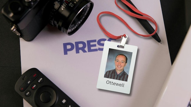 Sean Ottewell press pass with reporters tools