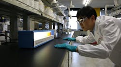 Worker in Eastman lab Worker in Eastman lab