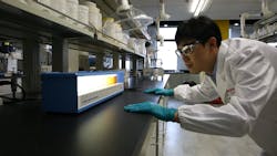 Worker in Eastman lab Worker in Eastman lab