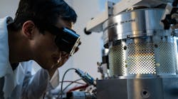 Xiang Zhang with the microwave plasma chemical vapor deposition setup. (Photo by Jeff Fitlow/Rice University) Xiang Zhang with the microwave plasma chemical vapor deposition setup. (Photo by Jeff Fitlow/Rice University)