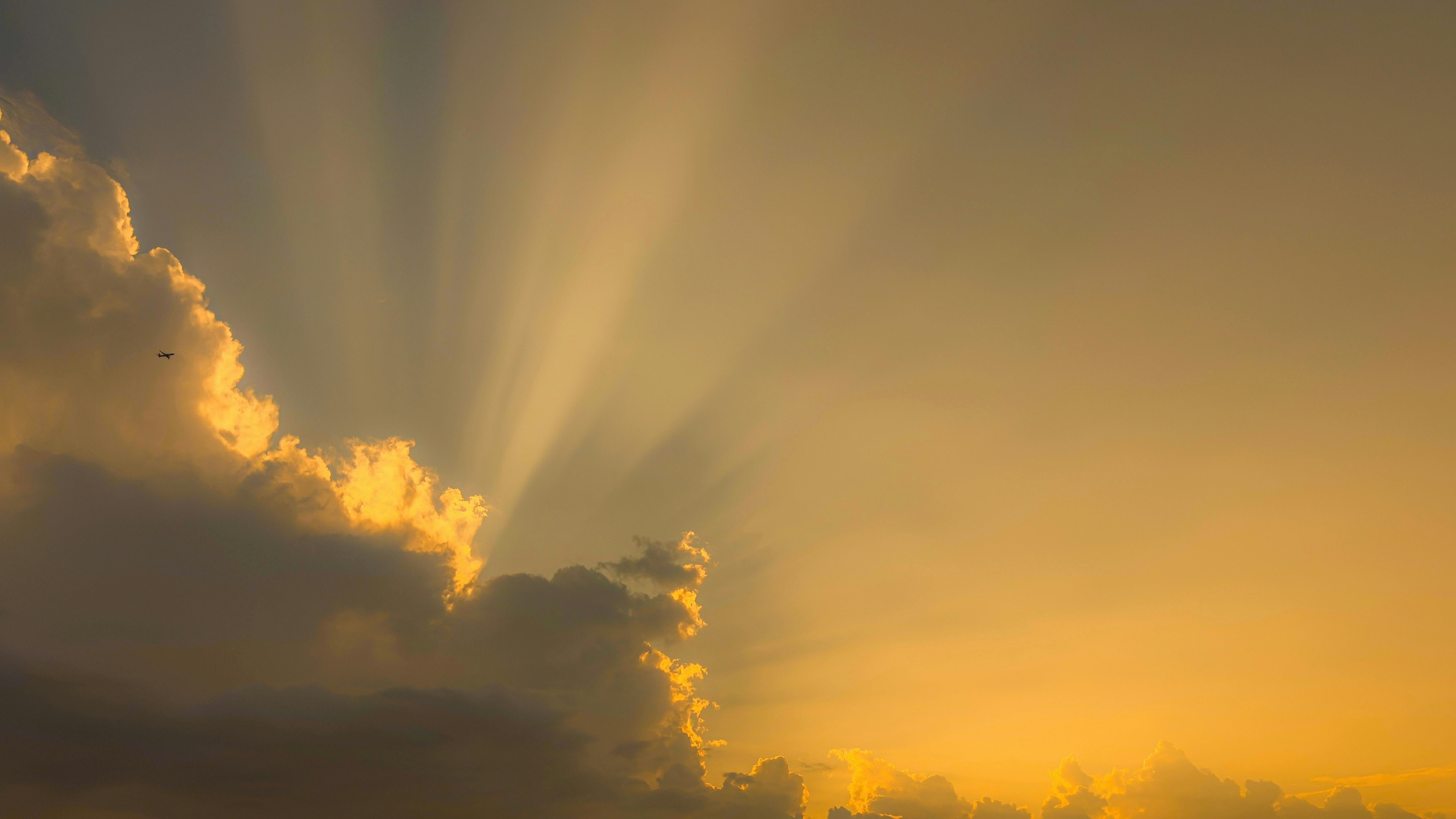 Clouds with sun rays behind them