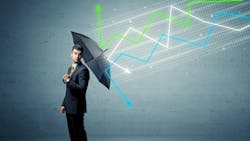 man in suit holding umbrella with economic line graphs 'falling' onto and bouncing off umbrella man in suit holding umbrella with economic line graphs 'falling' onto and bouncing off umbrella