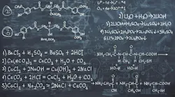 Chalkboard with chemical formulas.