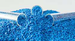 three test test tubes sit in pile of blue plastic pellets