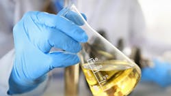 hands in protective gloves hold test tube filled with liquid chemical for testing hands in protective gloves hold test tube filled with liquid chemical for testing
