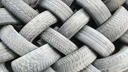 A pile of old used tires close-up A pile of old used tires close-up