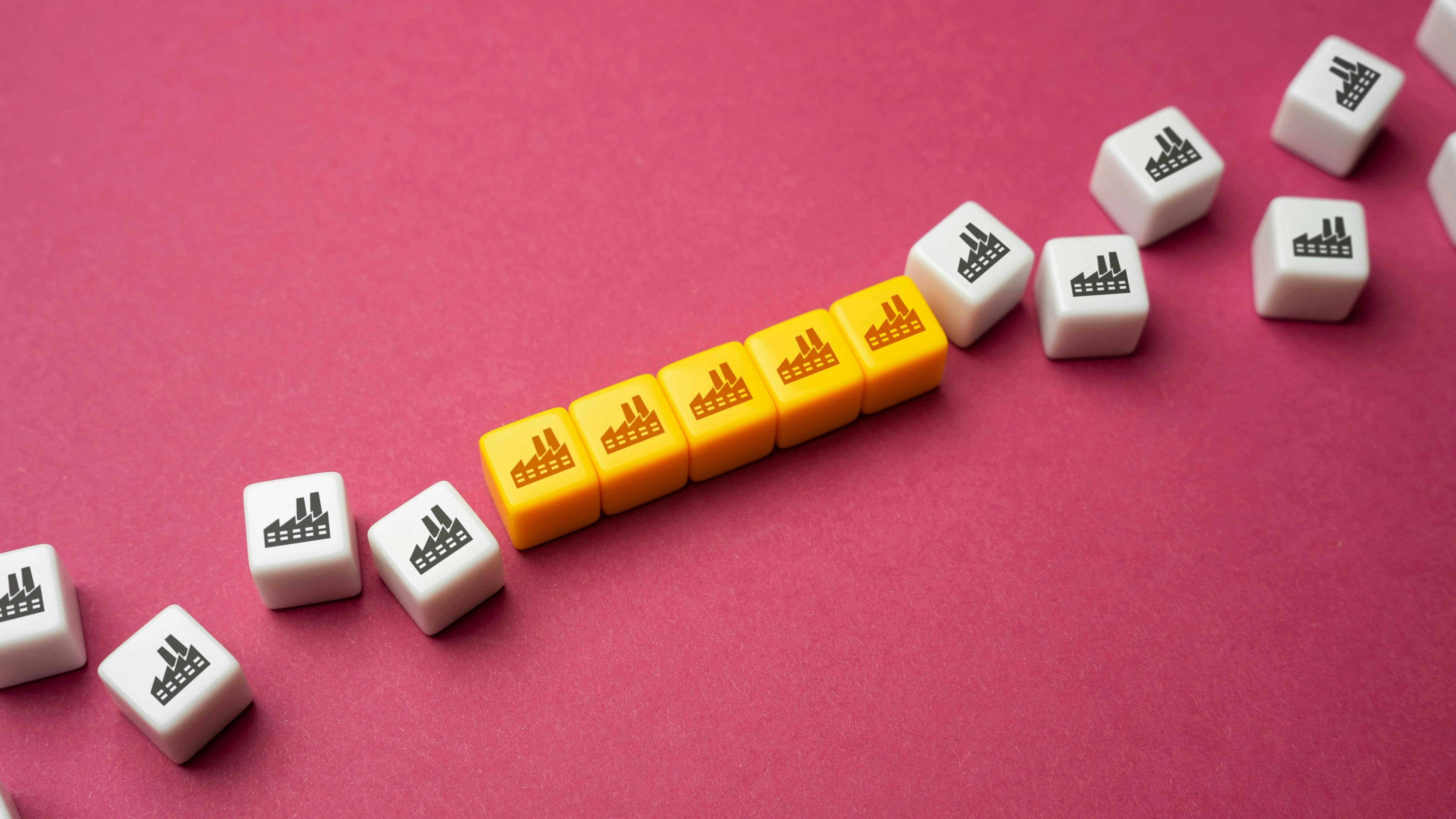 blocks with factory icon combined together to represent consolidation