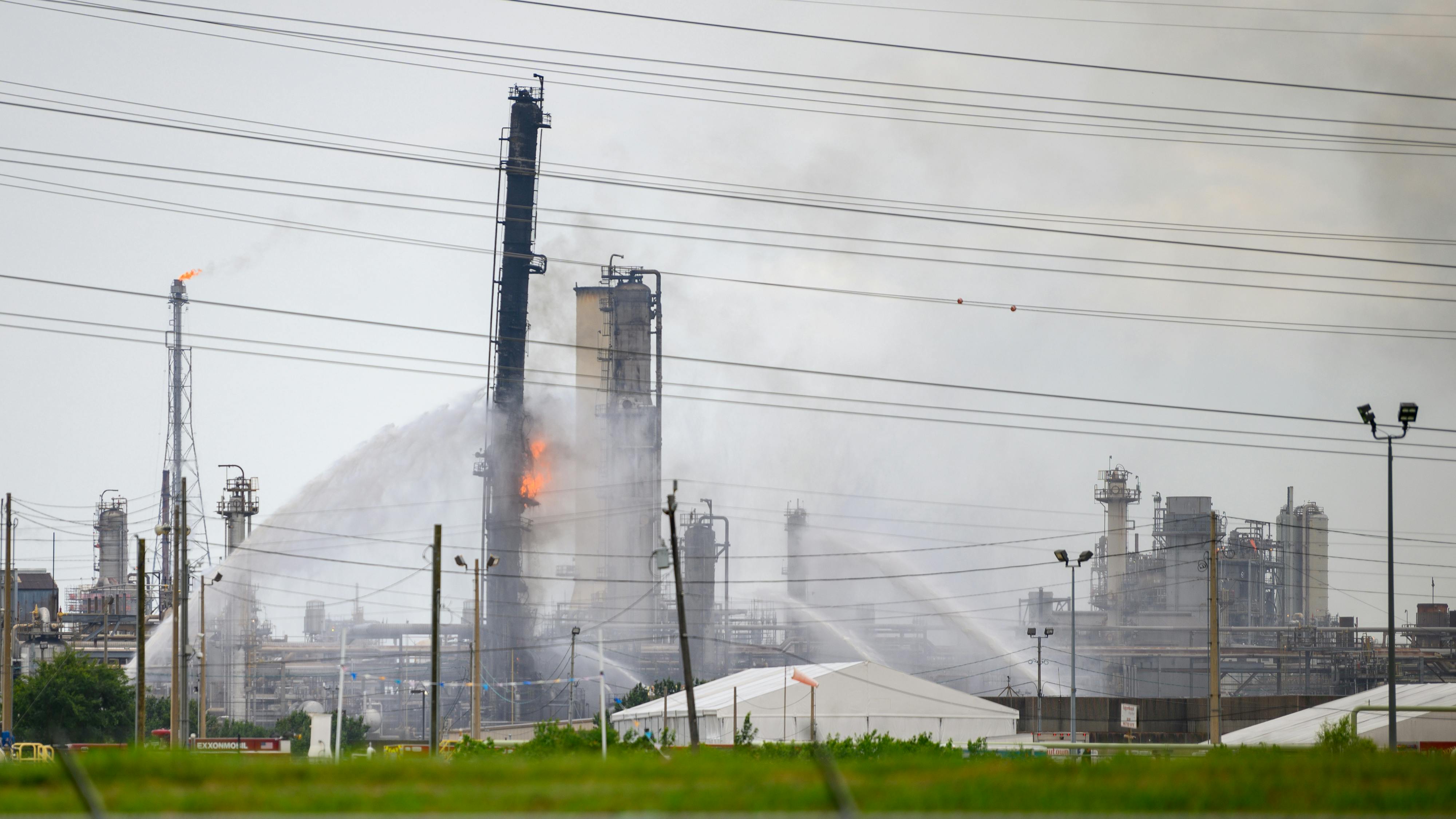 Baytown, Texas - July 31, 2019: Firefighters battle blaze after explosion at the ExxonMobil Baytown Olefins chemical plant in Baytown, near Houston Texas