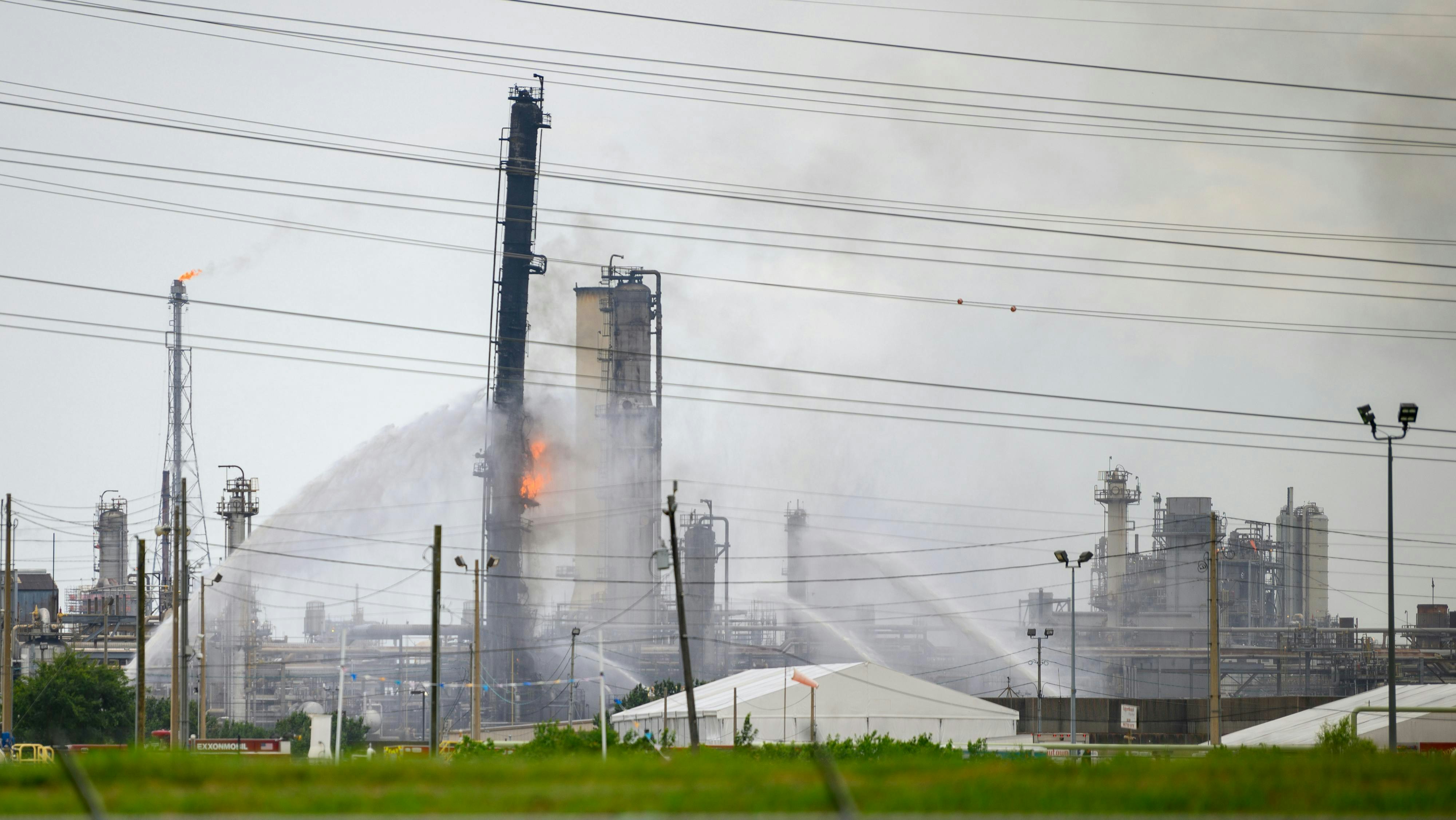 Baytown, Texas - July 31, 2019: Firefighters battle blaze after explosion at the ExxonMobil Baytown Olefins chemical plant in Baytown, near Houston Texas