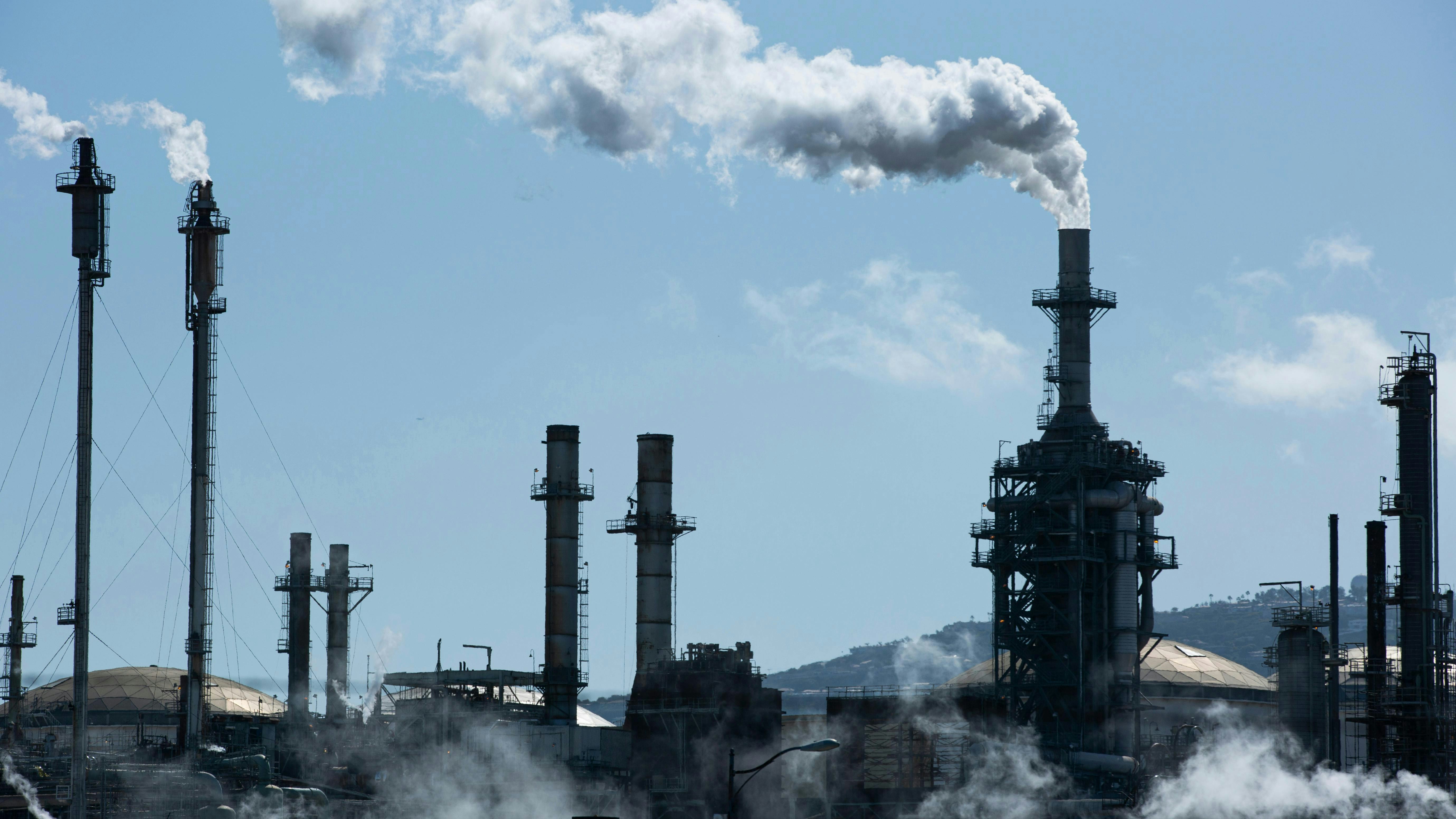 A refinery spews out greenhouse gases