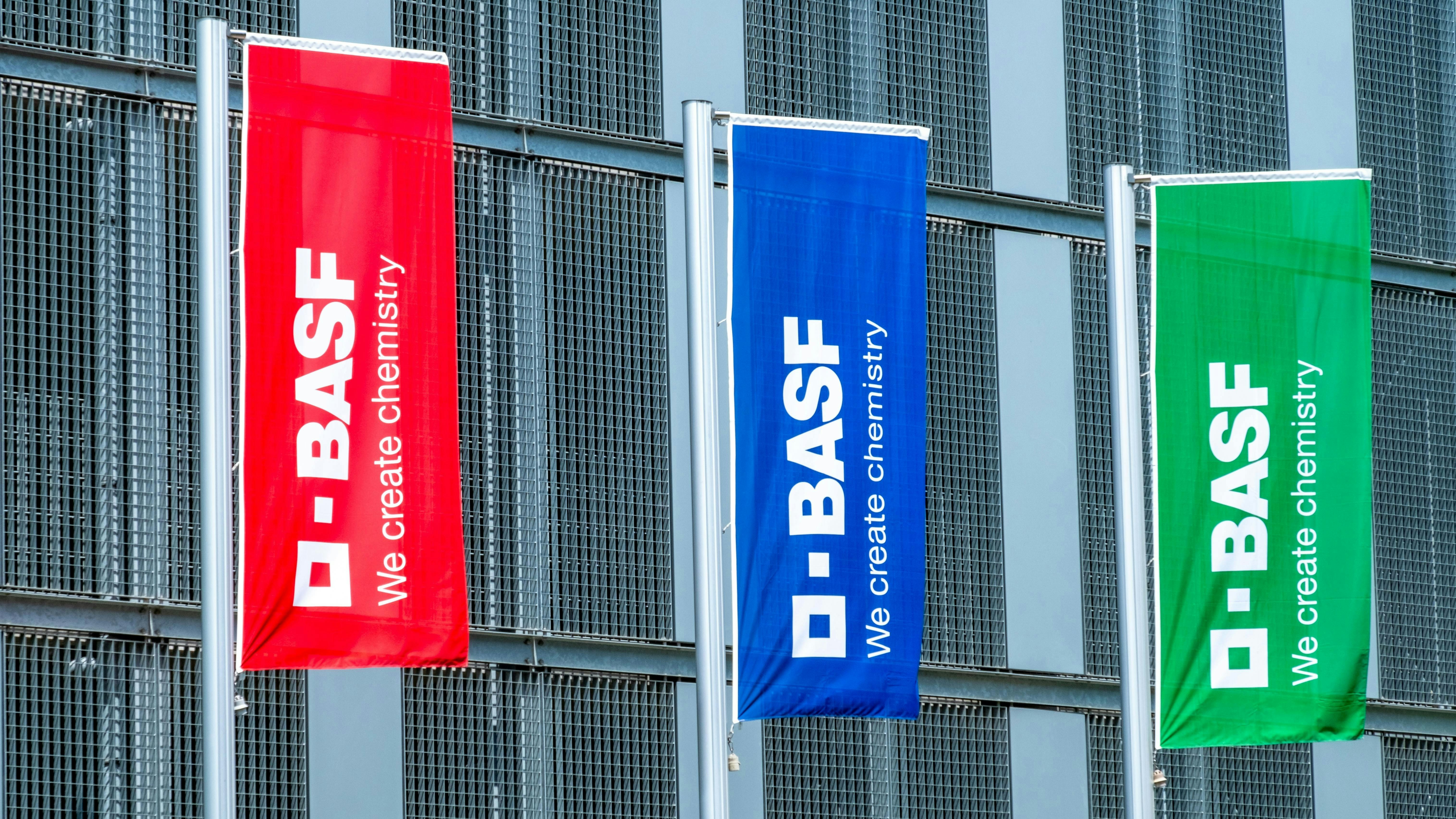 Colorful flags with BASF logo fly at company headquarters
