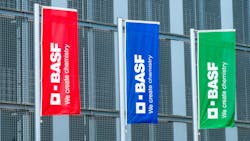 Colorful flags with BASF logo fly at company headquarters Colorful flags with BASF logo fly at company headquarters
