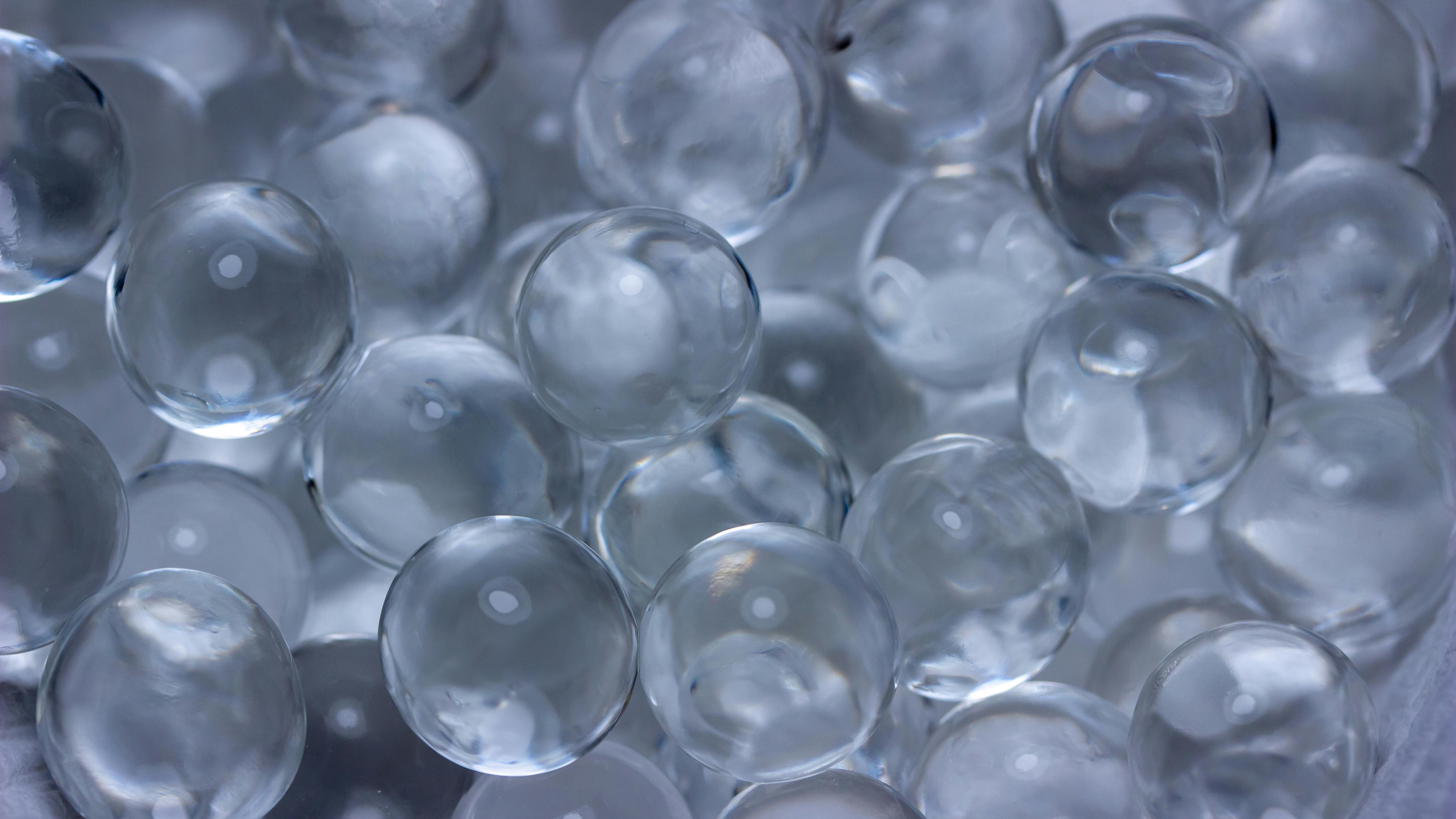 Macro abstract texture background of super absorbent polymer water gel beads having the appearance of wet glass beads