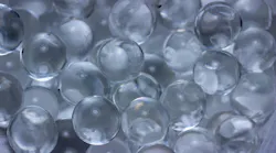 Macro abstract texture background of super absorbent polymer water gel beads having the appearance of wet glass beads