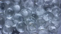 Macro abstract texture background of super absorbent polymer water gel beads having the appearance of wet glass beads Macro abstract texture background of super absorbent polymer water gel beads having the appearance of wet glass beads