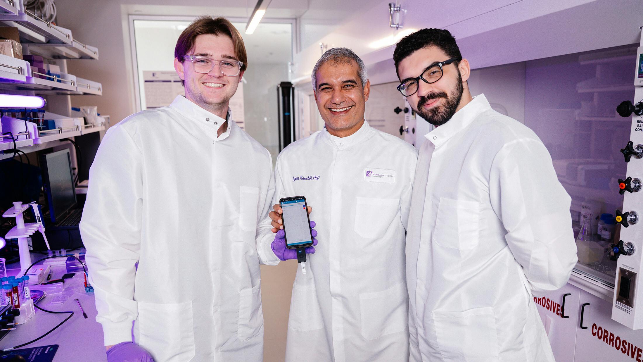 Dr. Ajeet Kaushik (center), an associate professor of chemistry at Florida Polytechnic University, works with research assistants Riley Orr (left) and Justin Sanchez Almirola on new sensing technology to detect microplastics in water.