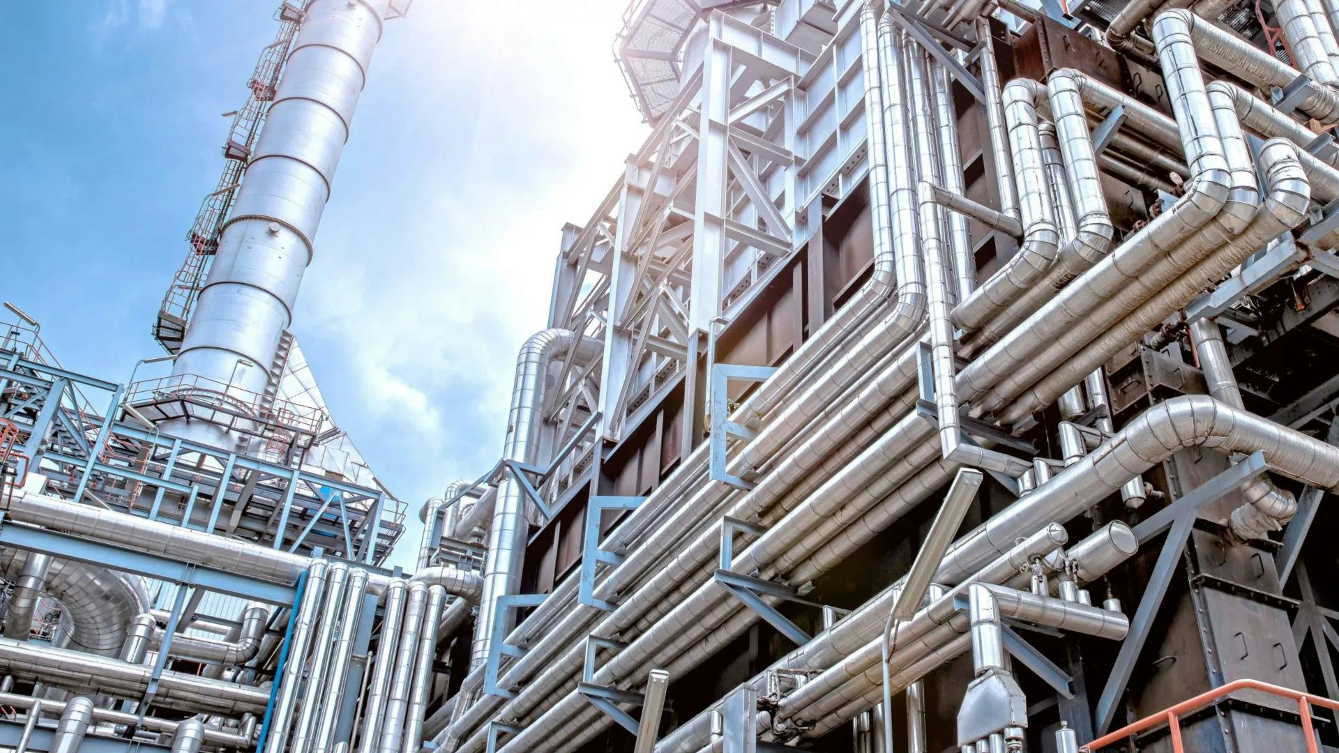 Honeywell Corp. plant infrastructure with pipes and distillation column visible