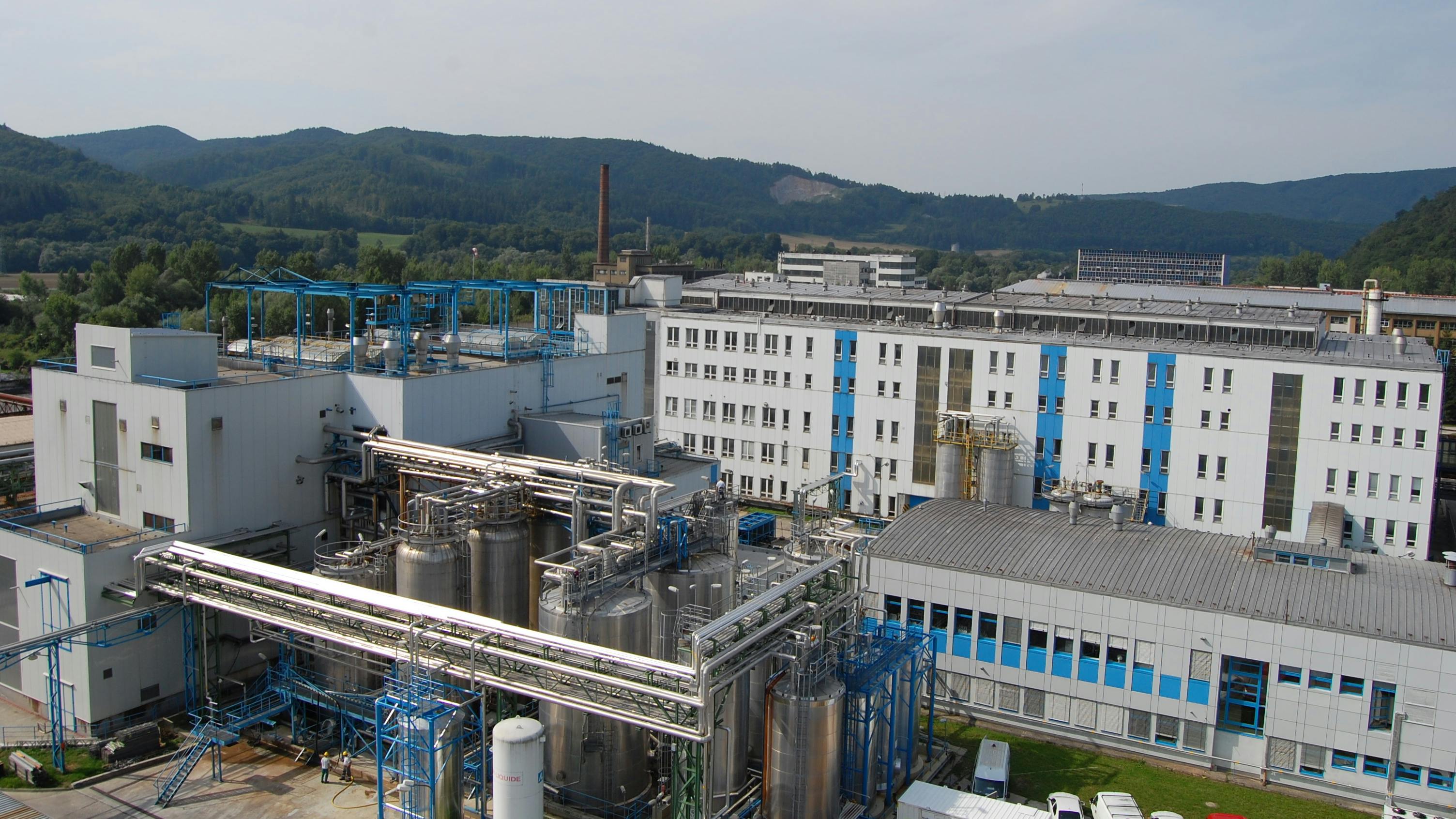 Aerial view of Evonik's Fermas site in Slovensk&aacute; &Lcaron;up&ccaron;a, Slovakia with mountains in the background