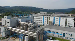 Aerial view of Evonik's Fermas site in Slovenská Ľupča, Slovakia with mountains in the background