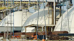 Large industrial facility with dome-shaped storage tanks Large industrial facility with dome-shaped storage tanks