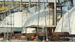 Large industrial facility with dome-shaped storage tanks