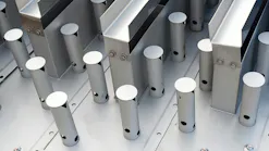 Close-up of polished metal cylindrical posts and rectangular beams bolted to an industrial steel frame. Close-up of polished metal cylindrical posts and rectangular beams bolted to an industrial steel frame.