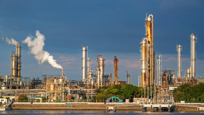 equipment of gas oil refining plant in Japan industrial factory area with blue sky background view from Fishing port, Yokkaichi, Mie Prefecture, Japan.