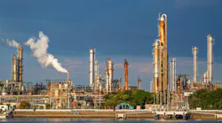 equipment of gas oil refining plant in Japan industrial factory area with blue sky background view from Fishing port, Yokkaichi, Mie Prefecture, Japan. equipment of gas oil refining plant in Japan industrial factory area with blue sky background view from Fishing port, Yokkaichi, Mie Prefecture, Japan.