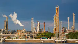 equipment of gas oil refining plant in Japan industrial factory area with blue sky background view from Fishing port, Yokkaichi, Mie Prefecture, Japan. equipment of gas oil refining plant in Japan industrial factory area with blue sky background view from Fishing port, Yokkaichi, Mie Prefecture, Japan.