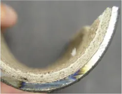 Image showing Layered CaCO3 deposits in an extracted boiler tube section. Image showing Layered CaCO3 deposits in an extracted boiler tube section.