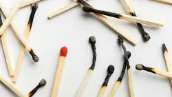 pile of burnt matchsticks with one unlit match on a white background pile of burnt matchsticks with one unlit match on a white background
