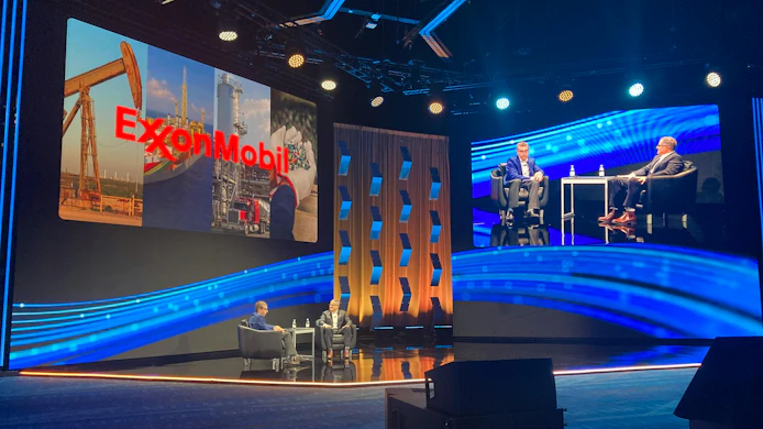 Dylan Pugh of ExxonMobil and Vincent Servello of AspenTech on stage at Optimize 26 in Houston