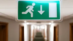 Exit sign in hotel hallway