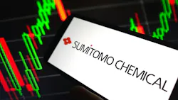 Sumitomo Chemical logo on phone screen with digital line graphs in background