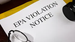 EPA Violation Notice Document Set on Wooden Desk – Environmental Protection Infraction Report