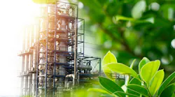 plant distillation columns surrounded by greenery indicating conservation concept