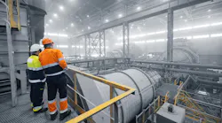 Industrial manufacturing mining workplace. Colleagues having discussion talk cooperation on during working process on background grinding ball mill with mineral gold ore