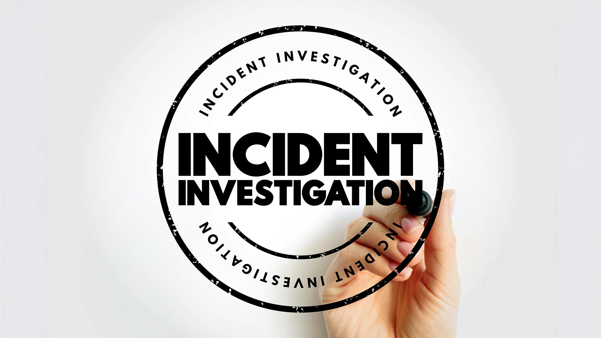 Incident Investigation stamp on white background with hand holding marker