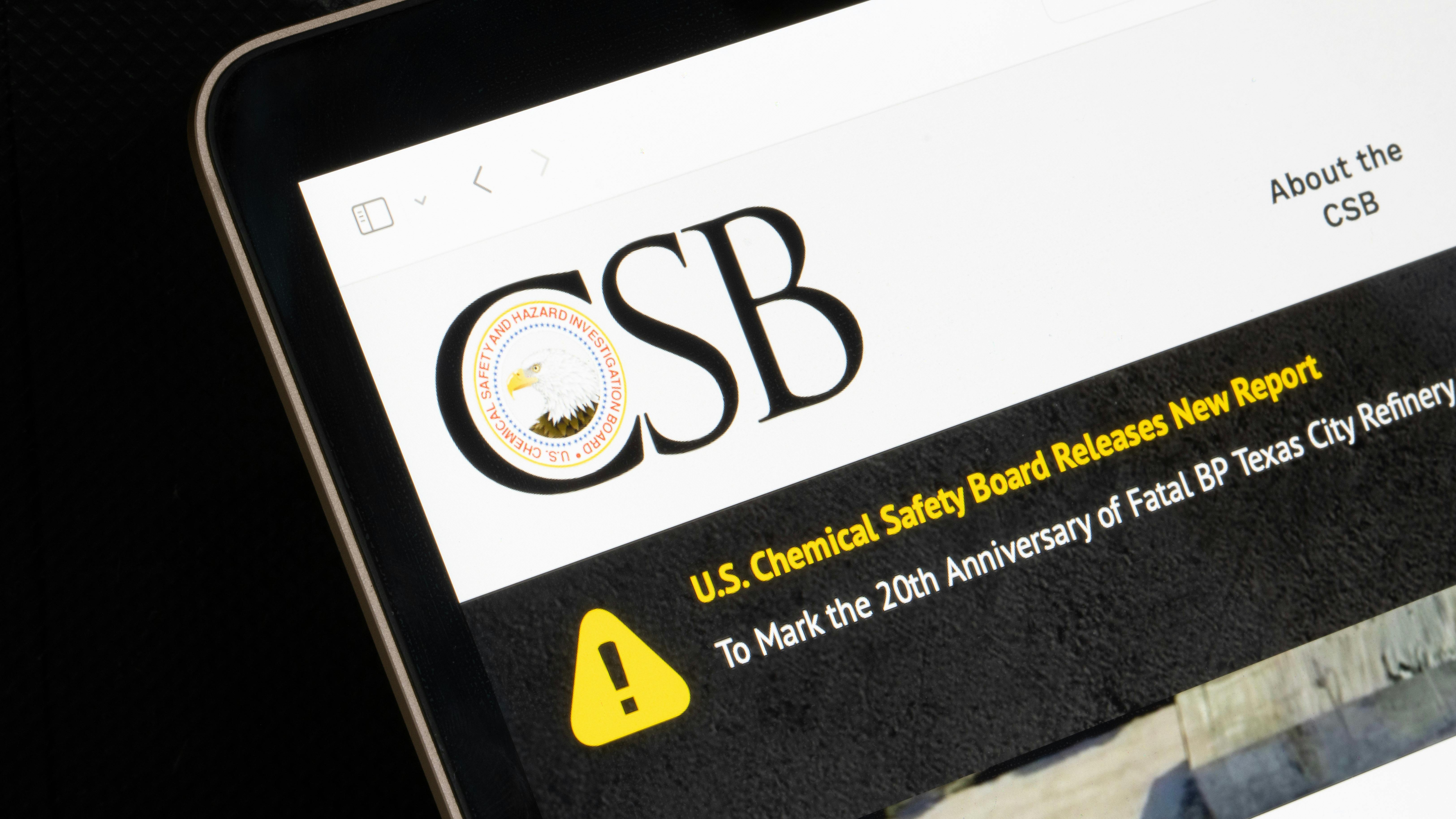 CSB logo and website displayed on laptop screen against a dark background