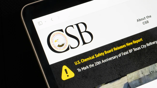 CSB logo and website displayed on laptop screen against a dark background