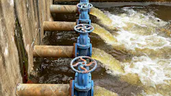 Blue pumps and valves discharge industrial wastewater