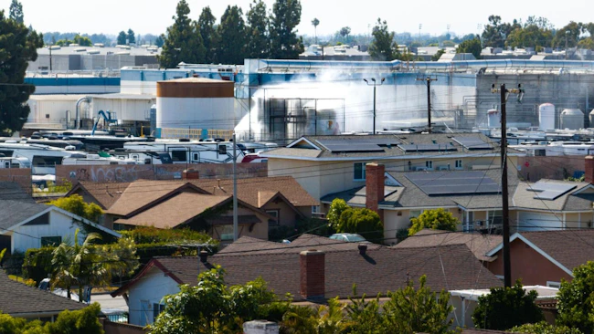 GARDEN GROVE, CA - MAY 24, 2026: An aerial of water being sprayed on large storage tanks at the GKN Aerospace facility on Sunday, May 24, 2026, in Garden Grove, CA. 44,000 people remain evacuated after a 34,000-gallon tank of methyl methacrylate (MMA) leaked at a garden Grove aerospace plastics facility, sending potentially toxic vapors into the air on Thursday.