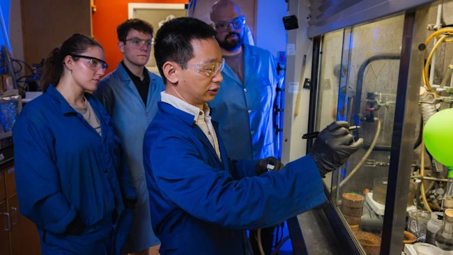 Virginia Tech researchers in the Liu Lab examine samples of engine oil created from upcycled plastic waste.