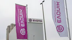 The logo of the Evonik chemical group at the Wesseling site in Germany