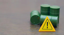 Caution Sign with Green Barrels Symbolizing Hazardous Waste and Environmental Risk